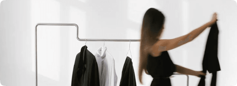 Fashion model walking in dark outfit